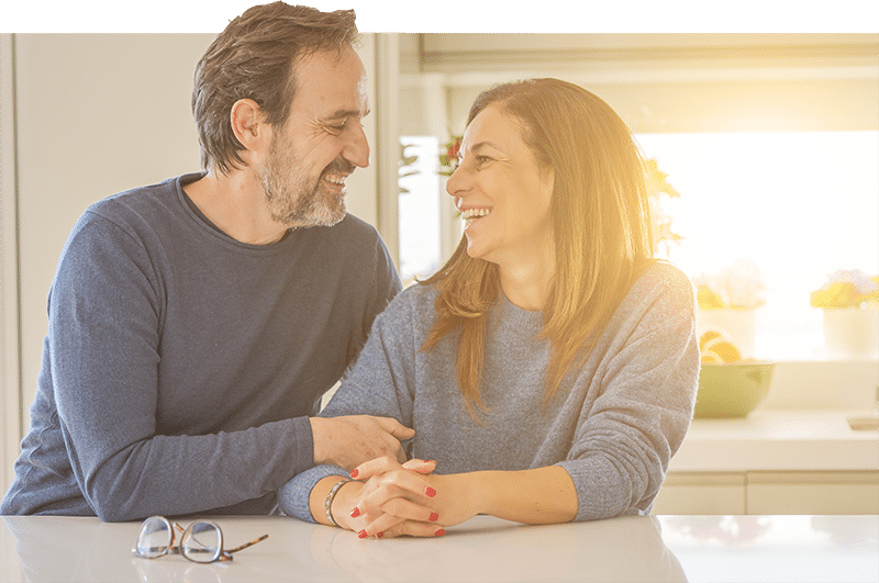 couple smiling at each other - tax management services